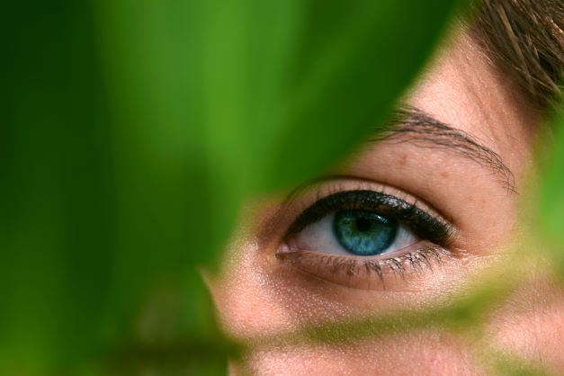 Woman-looking-thro-Leaves